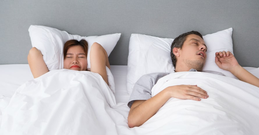 Man and woman sleeping in the bed