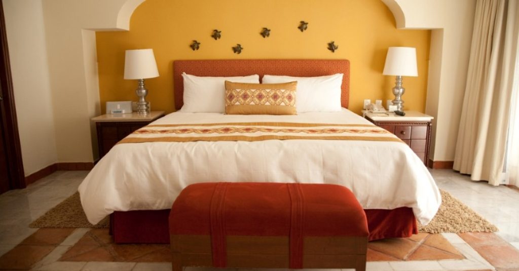 king size bed in orange room