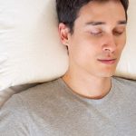 man-sleeping-on-a-buckwheat-pillow