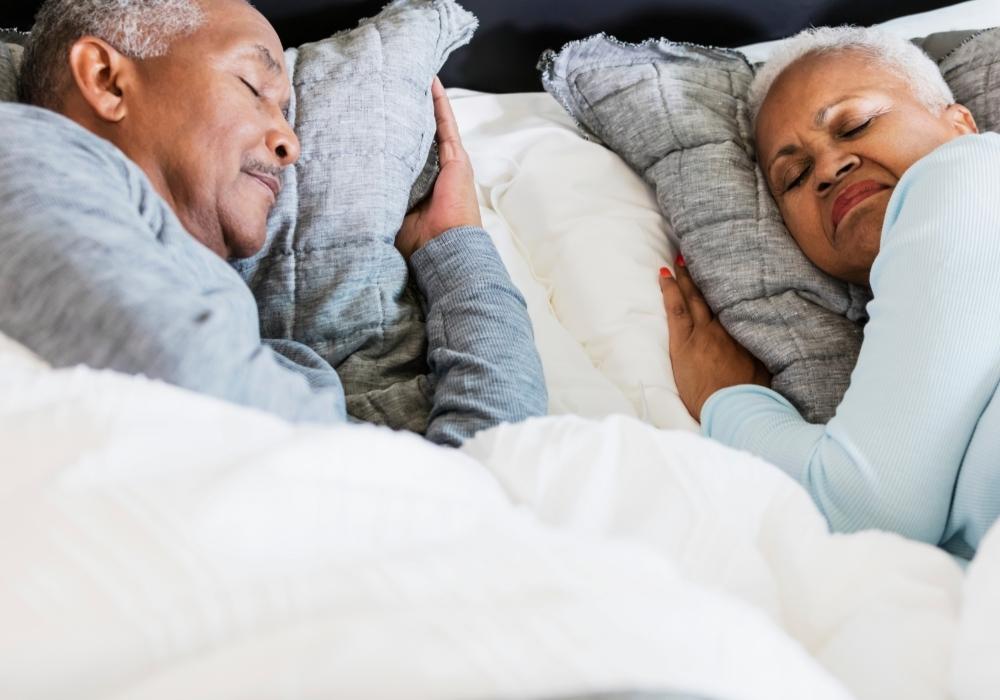 Elderly couple under a weighted blanket