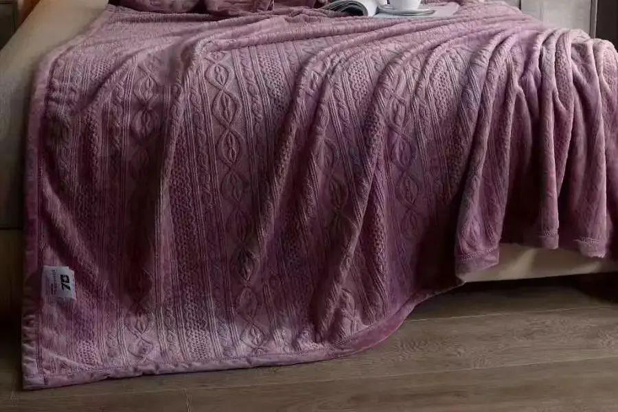 fleece blanket on bed