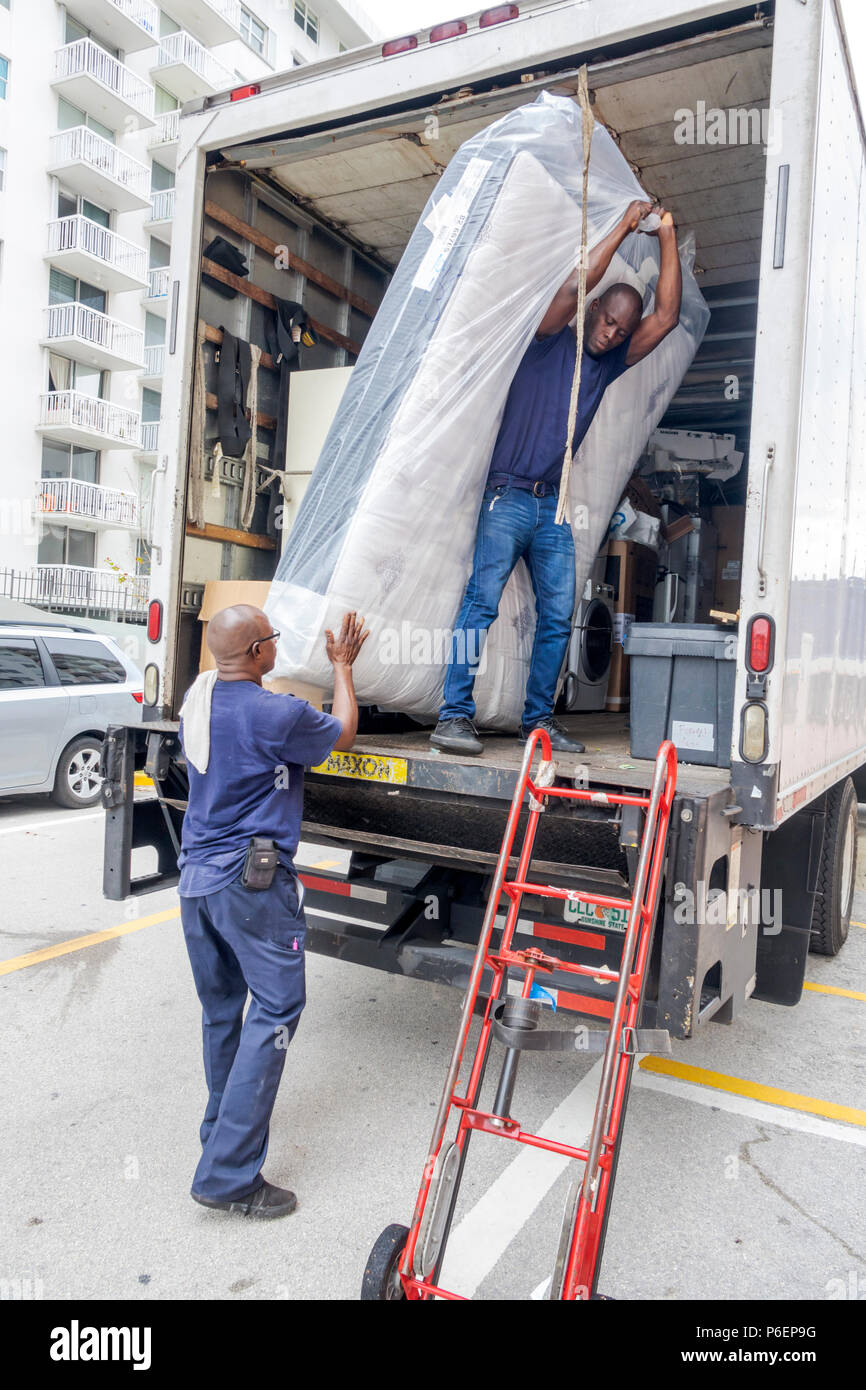 Loading The Mattress Onto The Moving Truck